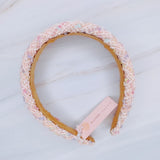 Elegant headband crafted from soft pastel tweed fabric with subtle texture and charm—perfect for a polished, feminine look with a hint of vintage flair.