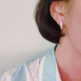 Gold mini hoop earrings with curved wave texture – simple yet elegant design