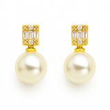 Gold-plated stud earrings featuring a luminous round pearl paired with a vertically set baguette-cut cubic zirconia, offering a sophisticated mix of classic and modern sparkle.