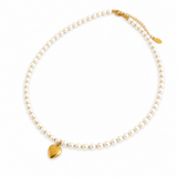 Necklace with gold heart pendant and pearl chain on a white background