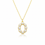 Gold necklaces with pearl beads on a initial pendant O with white background