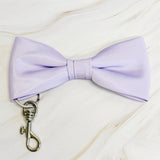 Lavender bow tie with a metal clasp on a light background
