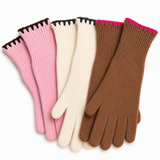 Four pairs of knit gloves arranged in a fan shape on a white background, showing pink, cream, and brown colors with contrasting black and bright pink cuff trim.