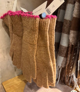 Brown fingerless gloves with pink cuffs on a mannequin, with a scarf in the background.