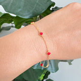 Delicate gold bracelet featuring a petite clover charm on a single fine chain. The minimalist design adds a touch of everyday elegance with its subtle shine and timeless silhouette, perfect for layering or wearing solo.