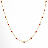 Gold-toned necklace featuring a delicate colored clover pendant, suspended on a fine chain for a soft pop of charm and color.