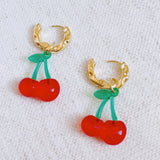 Playful cherry-themed earrings featuring vibrant red cherry charms with green stems, adding a fun and fruity touch to any outfit.