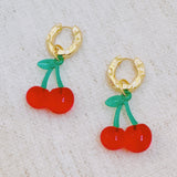 Playful cherry-themed earrings featuring vibrant red cherry charms with green stems, adding a fun and fruity touch to any outfit.