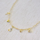 Gold chain necklace featuring playful pickleball-themed charms including a pickleball paddle, a ball, a star, and a colorful striped square accent, perfect for fans of the sport.