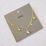 Gold chain necklace featuring playful pickleball-themed charms including a pickleball paddle, a ball, a star, and a colorful striped square accent, perfect for fans of the sport.