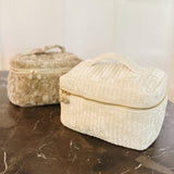 Quilted velvet vanity bag with top handle and zipper closure, available in creamy velvet and vintage moss color variants