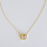 Dainty chain necklace featuring a radiant emerald-cut pendant in a classic prong setting, offering timeless elegance with a subtle touch of sparkle.