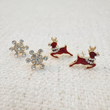 Set of mini stud earrings featuring snowflake and reindeer charms – dainty and winter-themed