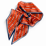 Orange scarf with black and white pattern on a white background