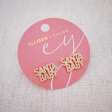 Festive stud earrings with gold-tone holiday charm and subtle sparkle – chic Santa baby style