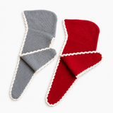Two ribbed knit sleeveless cover-ups, one gray and one red, both featuring a white scalloped trim, displayed on a clean white background.