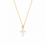 Gold necklace with a cross pendant featuring pearls on a white background