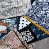 Elegant satin square scarf with a smooth, glossy finish—perfect for versatile styling as a hair accessory, neck tie, or bag accent.