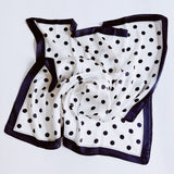 Elegant satin square scarf with a smooth, glossy finish—perfect for versatile styling as a hair accessory, neck tie, or bag accent.