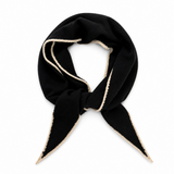 A black knit scarf with a cream-colored fuzzy trim, tied in a knot and displayed against a solid white background.