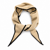 A beige scarf with black contrast trim, styled in a looped knot on a clean white background.