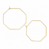 A pair of large, open geometric hoop earrings in a gold finish, featuring octagonal and hexagonal wireframe designs on a solid white background.