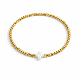 Beaded gold bracelet featuring a small polished cross charm centered. The So Very Blessed Cross Bracelet offers a meaningful, minimalist design perfect for everyday wear or gifting.