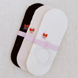 Set of three low cut socks featuring playful strawberry-themed patterns in soft pastel tones, designed for comfort and everyday charm.