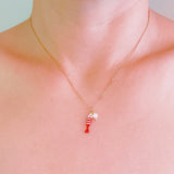 Brass necklace with red fish charm and pearl – cute nautical vibe