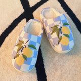 Soft indoor slippers featuring a bright lemon pattern on a checkered background, with a round-toe design, available in multiple sizes