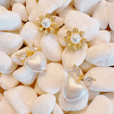 Set of two pearl earrings featuring playful sunny-side-up egg and classic pearl designs, combining whimsy with elegance.