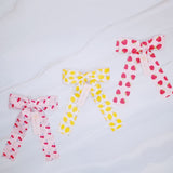 Colorful hair clip featuring a playful fruit print with lemons, strawberries, and cherries—adding a fun, fresh pop to any hairstyle.