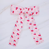 Colorful hair clip featuring a playful fruit print with lemons, strawberries, and cherries—adding a fun, fresh pop to any hairstyle.