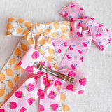 Colorful hair clip featuring a playful fruit print with lemons, strawberries, and cherries—adding a fun, fresh pop to any hairstyle.