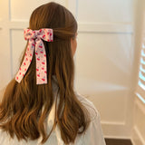 Colorful hair clip featuring a playful fruit print with lemons, strawberries, and cherries—adding a fun, fresh pop to any hairstyle.