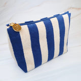 Versatile cosmetic pouch made from soft terry fabric with colorful striped detailing—perfect for storing makeup, toiletries, or everyday essentials on the go.