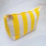 Versatile cosmetic pouch made from soft terry fabric with colorful striped detailing—perfect for storing makeup, toiletries, or everyday essentials on the go.