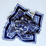 Lightweight textured square scarf with a soft finish, ideal for accessorizing hair, necklines, or handbags with effortless elegance.