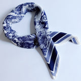 Lightweight textured square scarf with a soft finish, ideal for accessorizing hair, necklines, or handbags with effortless elegance.