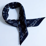 Lightweight textured square scarf with a soft finish, ideal for accessorizing hair, necklines, or handbags with effortless elegance.