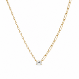 Gold chain necklace with a small diamond pendant on a white background