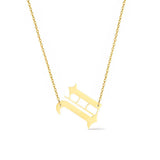 Gold-tone chain necklace featuring a bold Gothic-style initial charm that hangs asymmetrically to the side, adding a vintage-inspired yet edgy detail to your layered look.