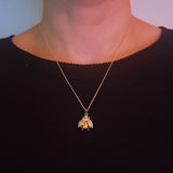 Gold-tone necklace featuring a vintage-style bee pendant with intricate detailing, offering a classic and nature-inspired look.