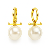 Sleek gold-tone toggle bar earrings featuring a lustrous pearl drop, blending modern structure with timeless charm for a refined, fashion-forward statement.