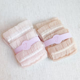Set of two socks adorned with cascading tulle lace detailing, adding a soft, romantic flair to any look.