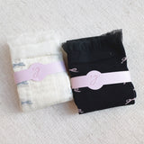 Set of two socks featuring tulle top accents with neatly lined-up bows, offering a delicate and elegant touch to any outfit.