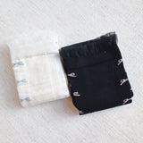 Set of two socks featuring tulle top accents with neatly lined-up bows, offering a delicate and elegant touch to any outfit.