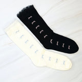 Set of two socks featuring tulle top accents with neatly lined-up bows, offering a delicate and elegant touch to any outfit.