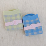 Set of two charming socks featuring classic gingham patterns with subtle twinkle accents, blending playful style with cozy everyday comfort.