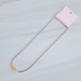 Silver-tone U-link chain necklace featuring a bold, gold lock pendant for a modern, edgy statement.
